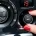 Driver adjusting the air conditioning controls inside a vehicle.