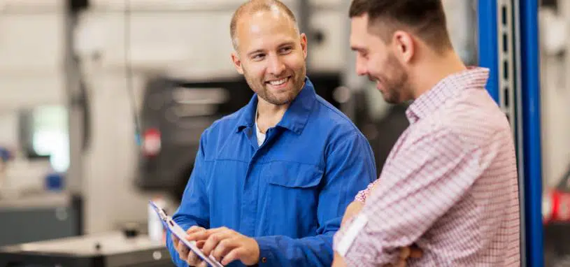 Team member in Natrad explaining radiator replacement options to a customer.
