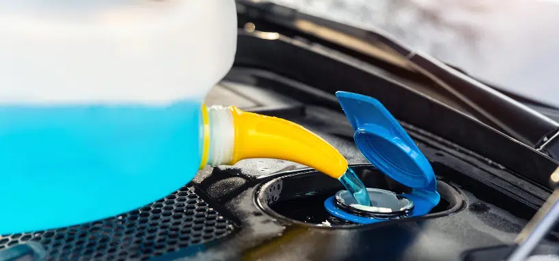Adding coolant to a vehicle's cooling system after radiator service.