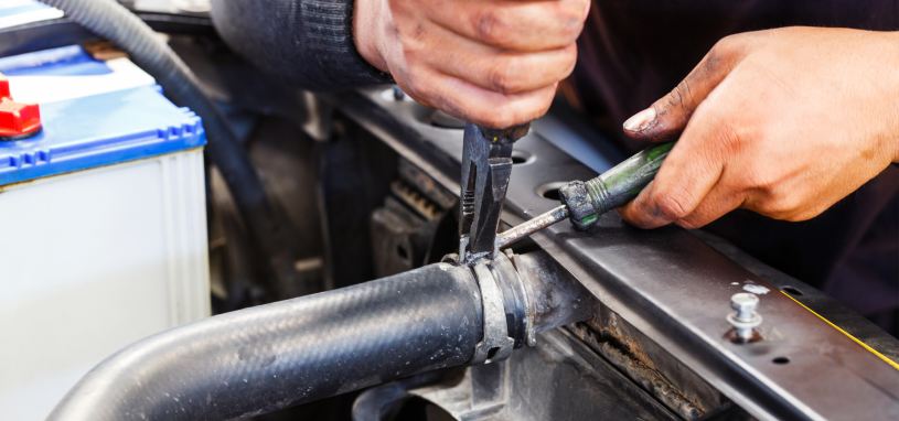 close motor vehicle mechanic repairing car