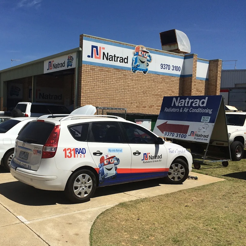 Rows of Natrad service vehicles parked outside our Natrad Morley workshop.