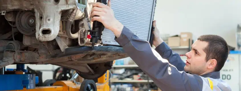 car mechanic changing radiator 1 845x321 jpg